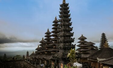 brown and gray concrete temple under blue sky during daytime